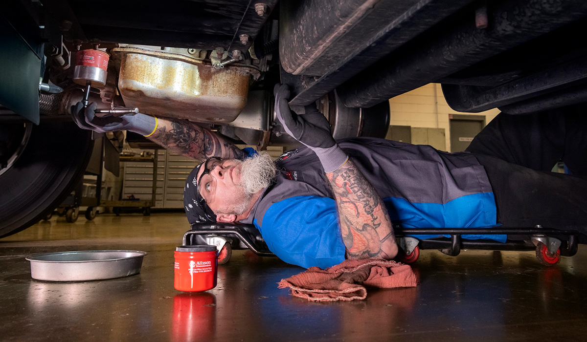 Photo of service technician changing oil filter