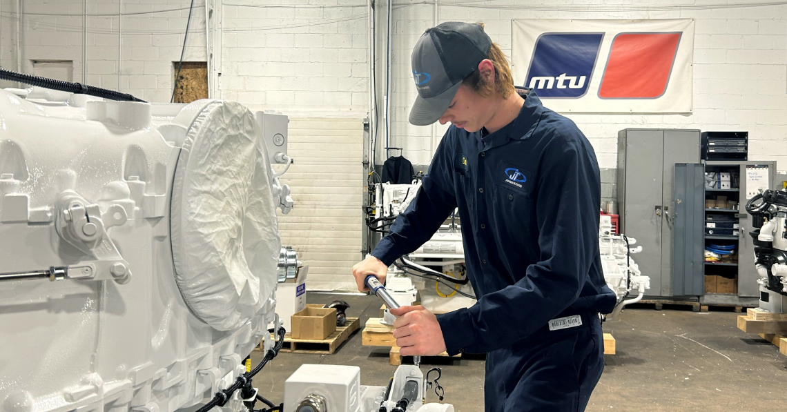 Technician working on equipment in a shop