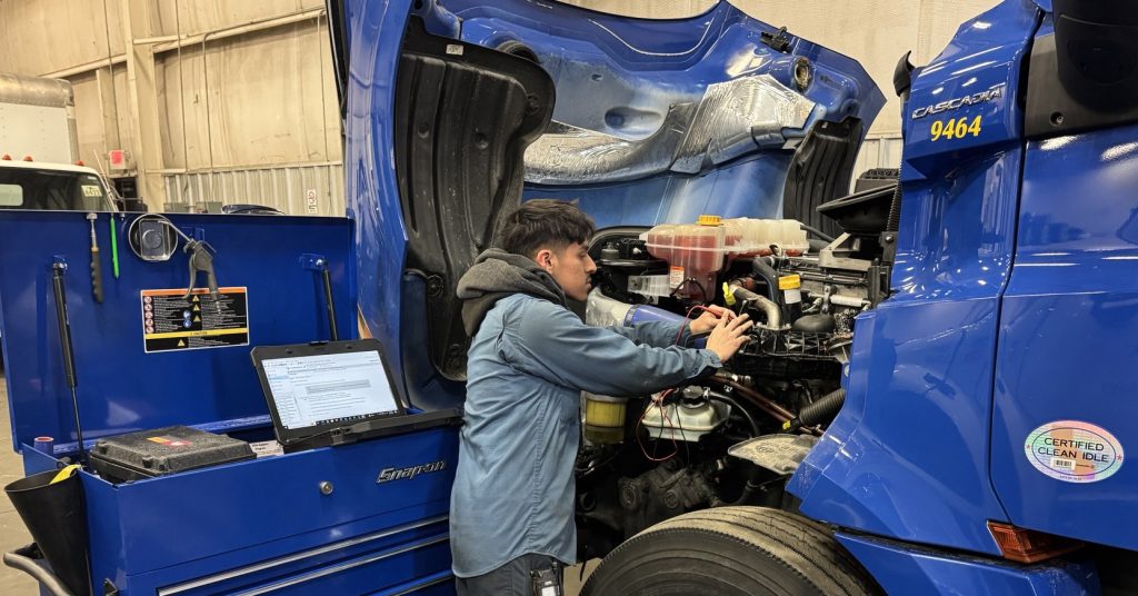 technician working on a truck